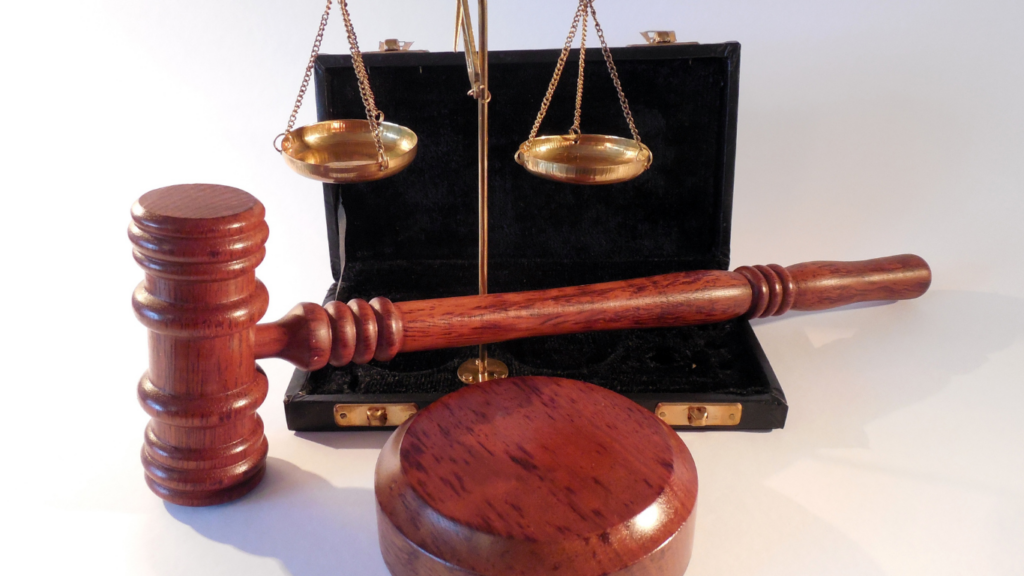 judge's gavel and books on white background