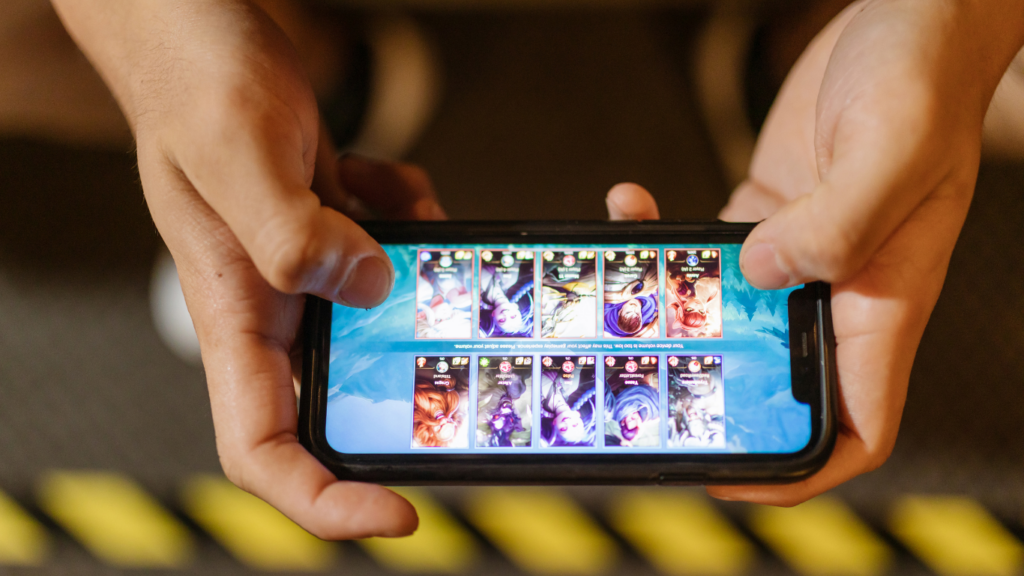 a person playing game in a smart phone