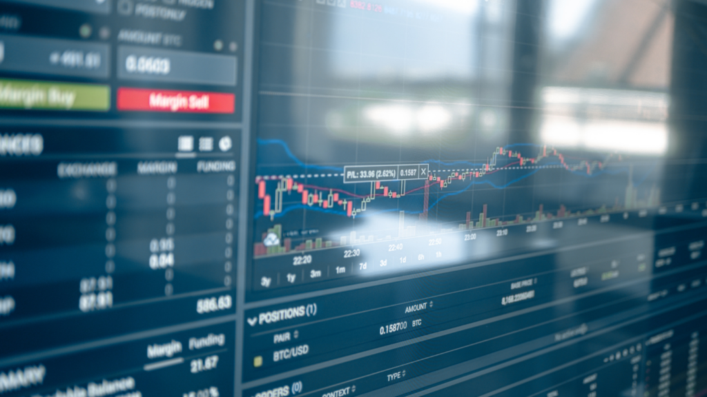 a person looking at a stock chart on a computer screen