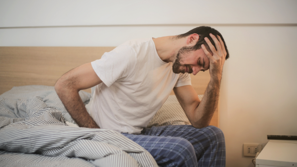 a person sitting at the bed