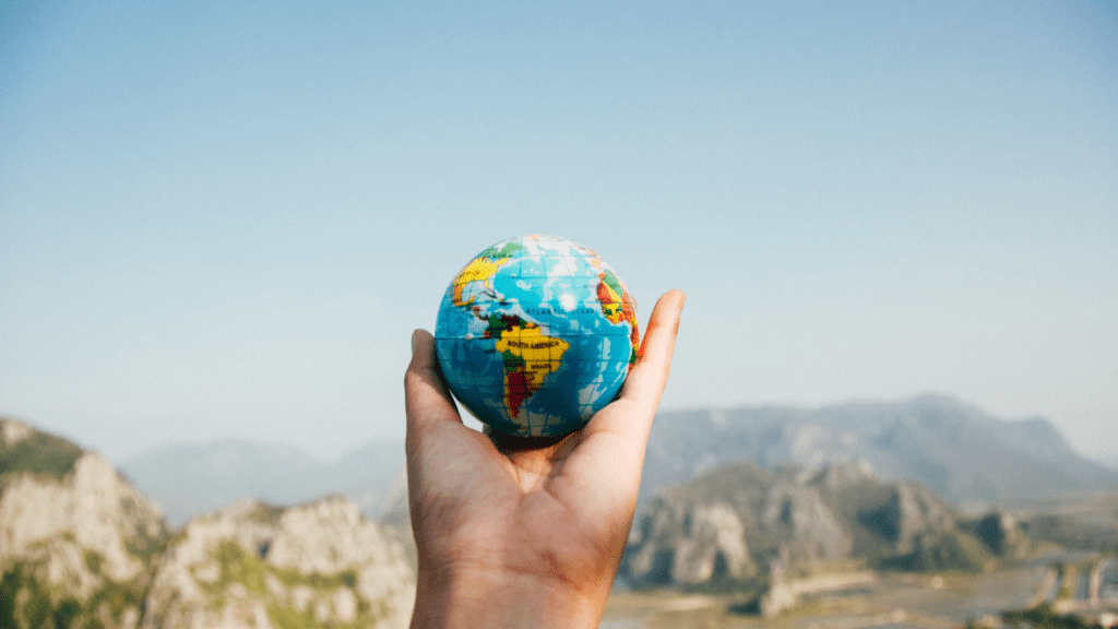 a persong holding a globe