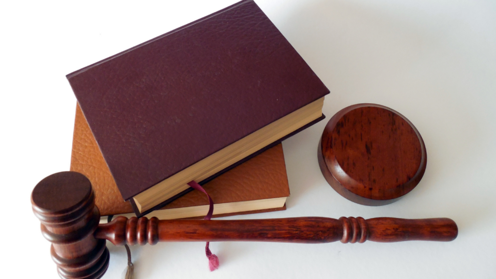 judge's gavel and books on white background